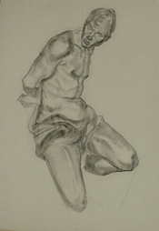 Student charcoal drawing of a kneeling figure