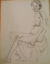 Student charcoal drawing of a seated female nude